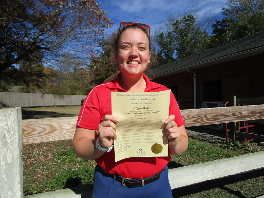 Alyssa Baron is a new therapeutic riding instructor at GAIT in Milford.
